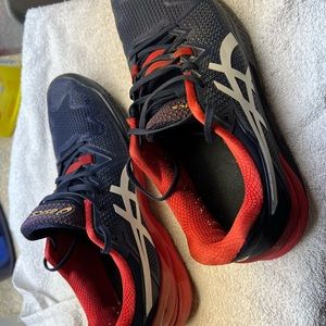 ASIC Gel Resolution 8 tennis shoes.